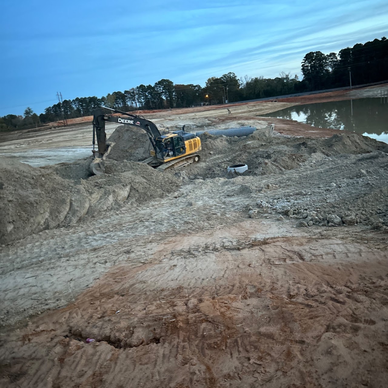 Excavator digging trench